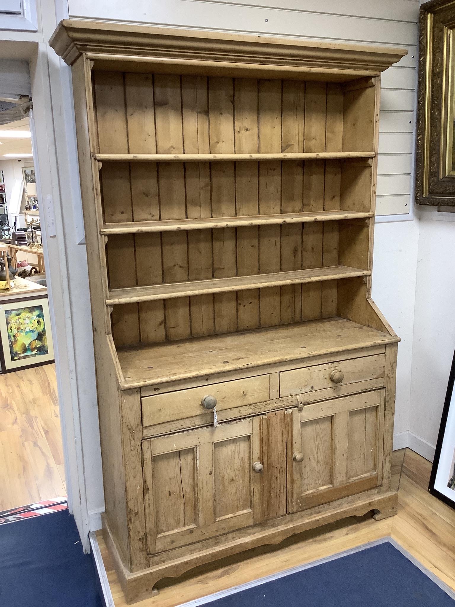 An early 19th century Irish pine dresser, length 122cm, depth 45cm, height 202cm